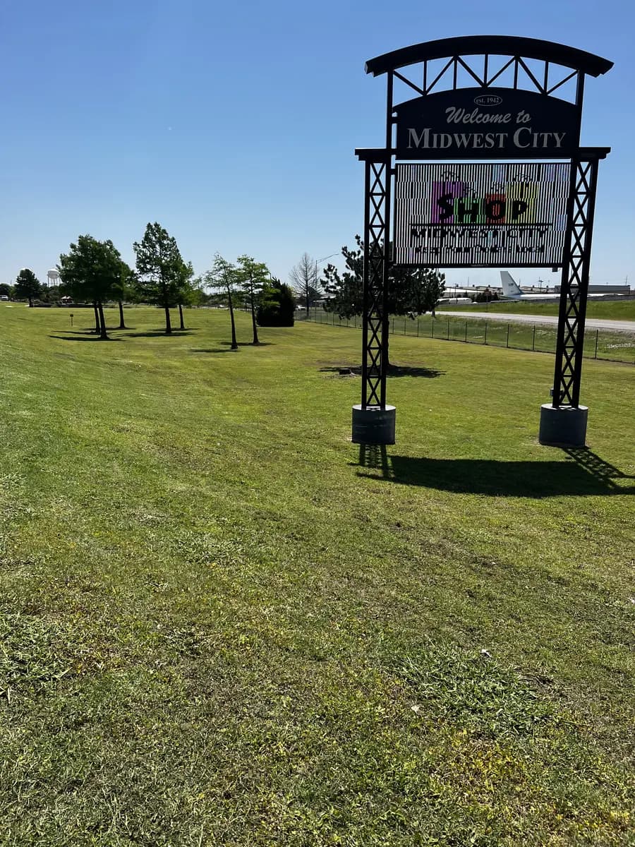 Maintained public lawn beside the Welcome to Midwest City sign
