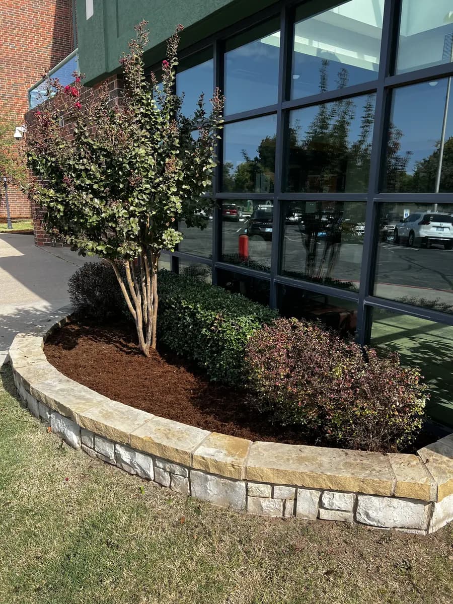 Clean commercial landscape beds at an Oklahoma office property