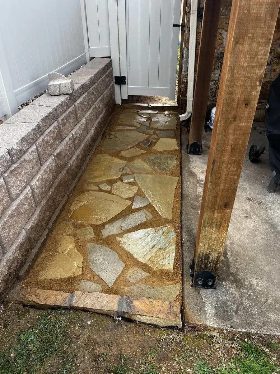 Finished flagstone landing and walkway beside a residential home